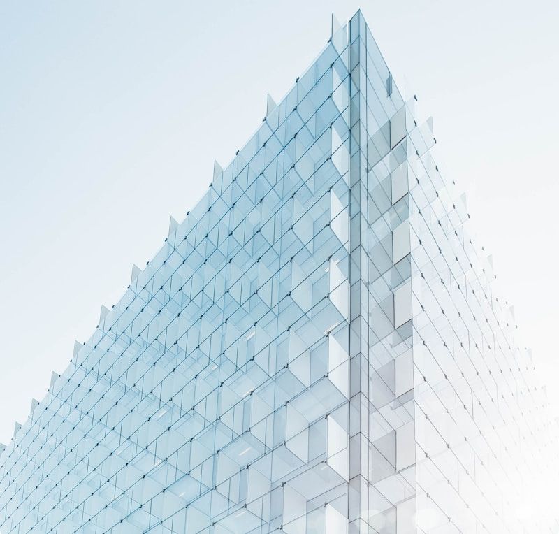 Glass building facade under a clear sky